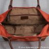 Intérieur du sac petit format en cuir et nylon avec poche zippée de couleur Orange
