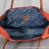 Intérieur du sac grand format Orange, deux poches sans zip et une poche avec zip