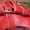 boucle bride et poches du sac à main rouge